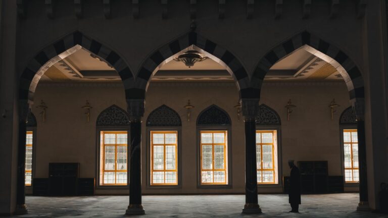 Mastering the First Impression: Your intriguing post title goes here Beautiful mosque interior showcasing intricate arches and natural light.